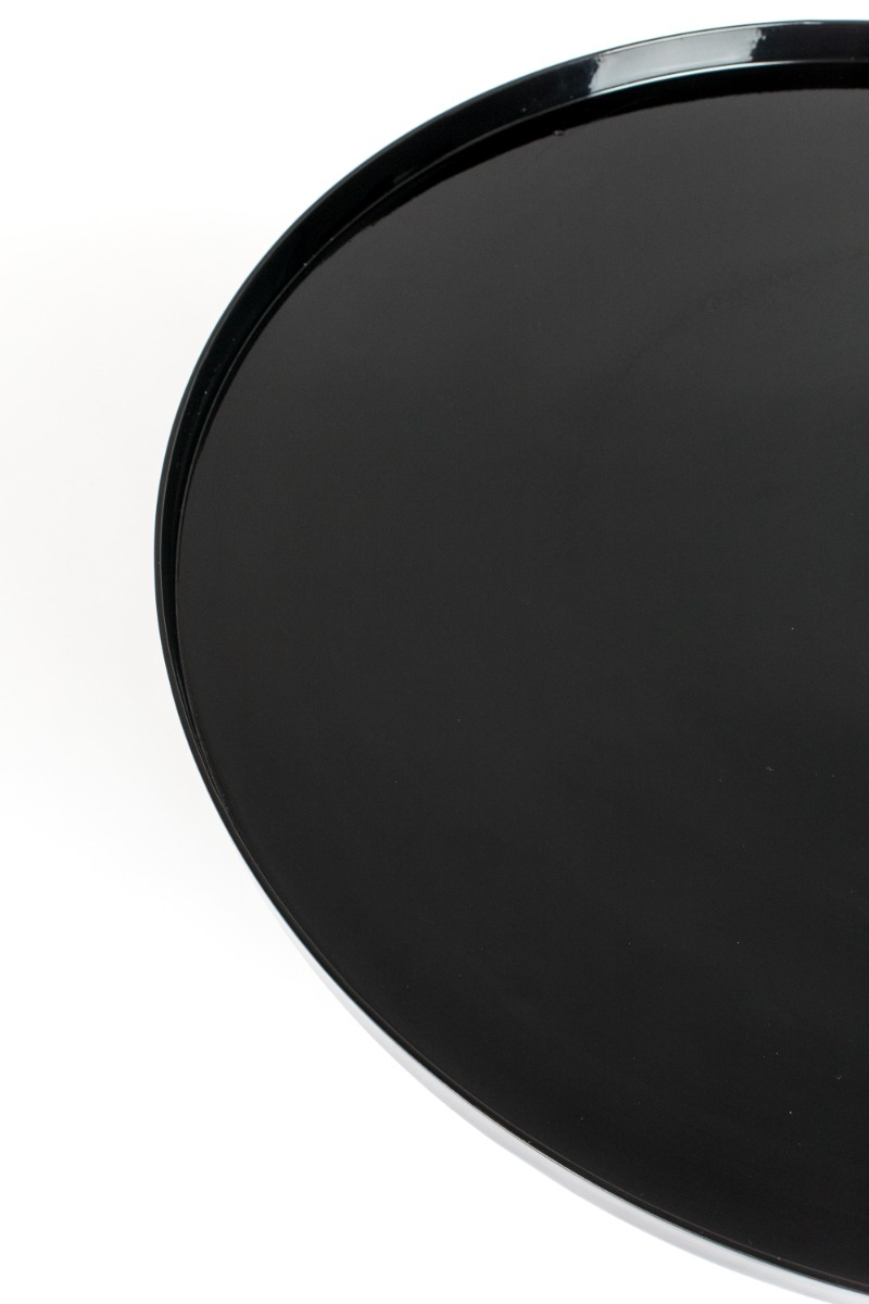 Round black pedestal table with a tall glossy base