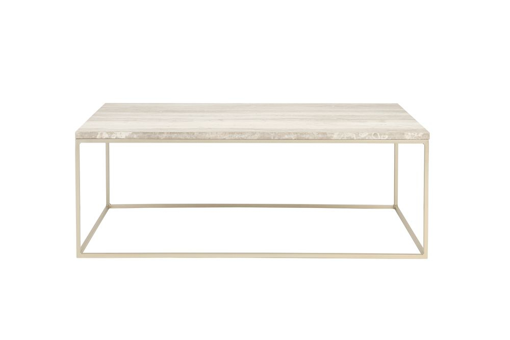 Close-up of a modern coffee table with a light wood top and thin beige metal frame
